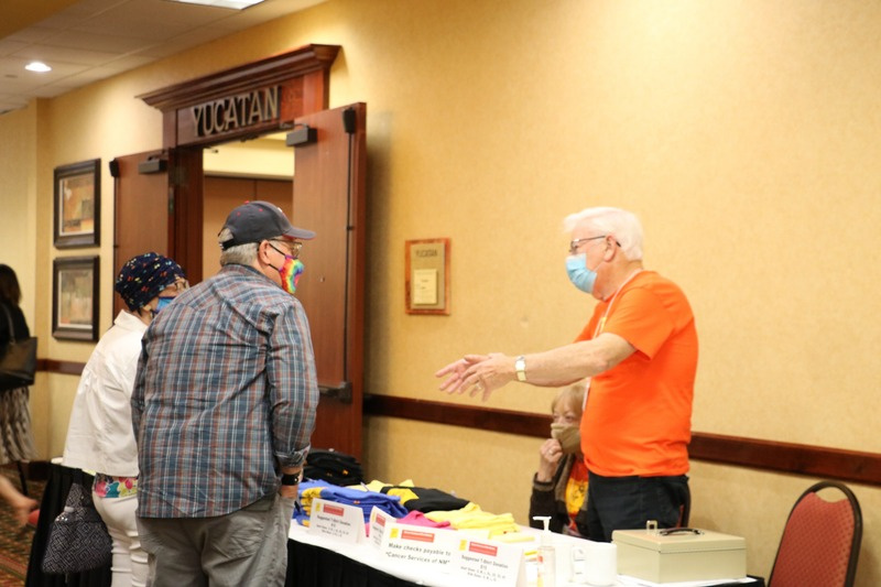 Volunteer greeting a participant at an event