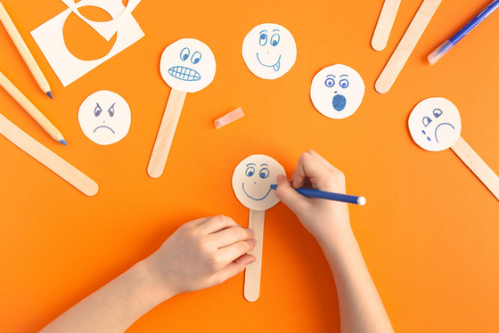 Child drawing emotion faces